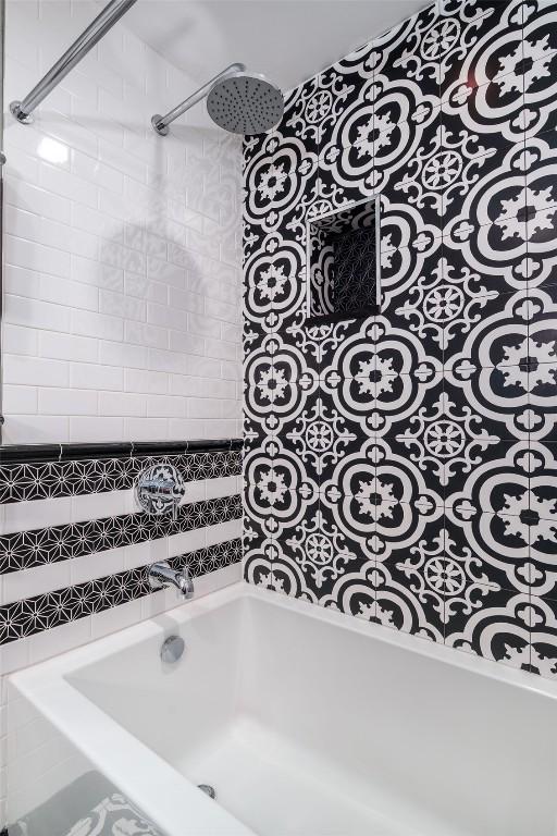1875 Ski Time Square Dr Unit 711, Steamboat Springs, CO 80487 - bathroom featuring a bath and a shower