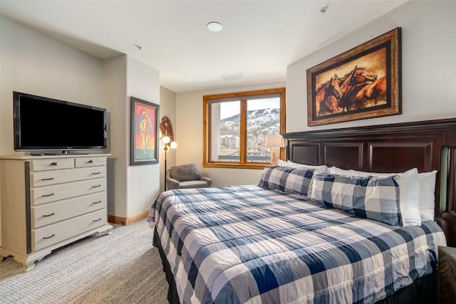 1875 Ski Time Square Dr Unit 711, Steamboat Springs, CO 80487 - bedroom featuring baseboards and light colored carpet