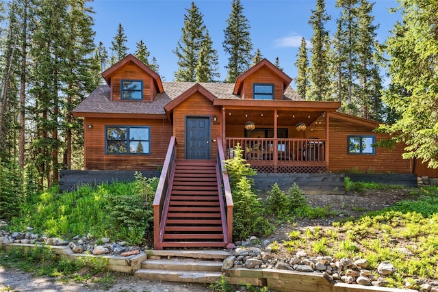 654 County Road 672, Breckenridge, CO 80424 - view of front of home featuring covered porch, stairs, and roof with shingles