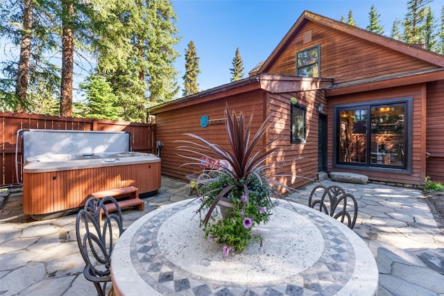 654 County Road 672, Breckenridge, CO 80424 - exterior space with fence, a patio, outdoor dining area, and a hot tub