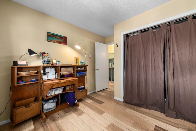 21 Balsam Ct, Steamboat Springs, CO 80487 - home office with wood finished floors, a textured ceiling, and baseboards