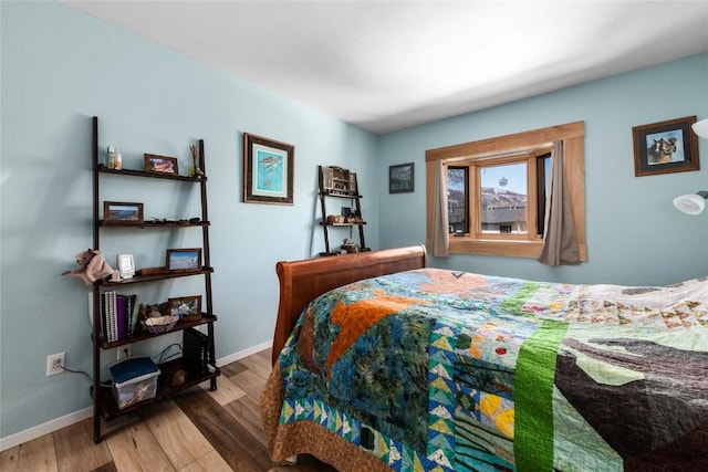 21 Balsam Ct, Steamboat Springs, CO 80487 - bedroom with baseboards and wood finished floors