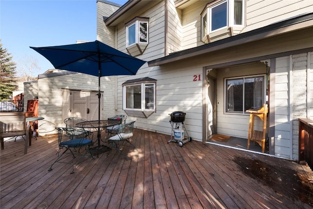 21 Balsam Ct, Steamboat Springs, CO 80487 - wooden terrace featuring outdoor dining area