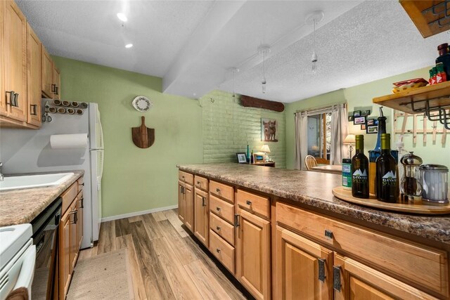 21 Balsam Ct, Steamboat Springs, CO 80487 - kitchen featuring a sink, baseboards, light wood-style floors, stove, and dishwasher