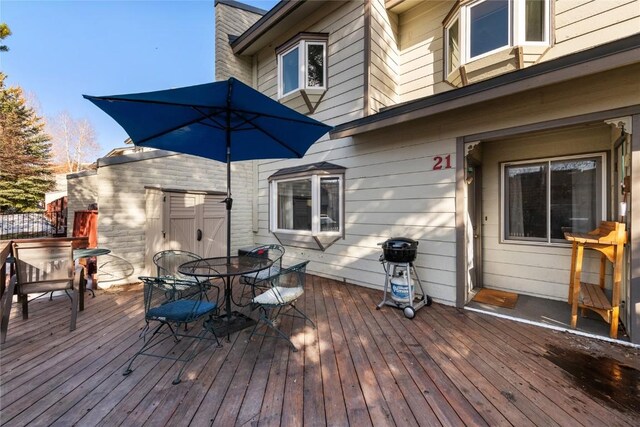 21 Balsam Ct, Steamboat Springs, CO 80487 - wooden deck with outdoor dining area