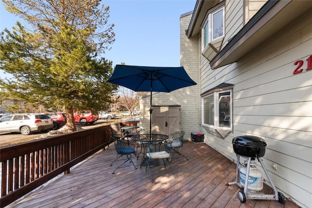 21 Balsam Ct, Steamboat Springs, CO 80487 - wooden terrace with outdoor dining area and a grill