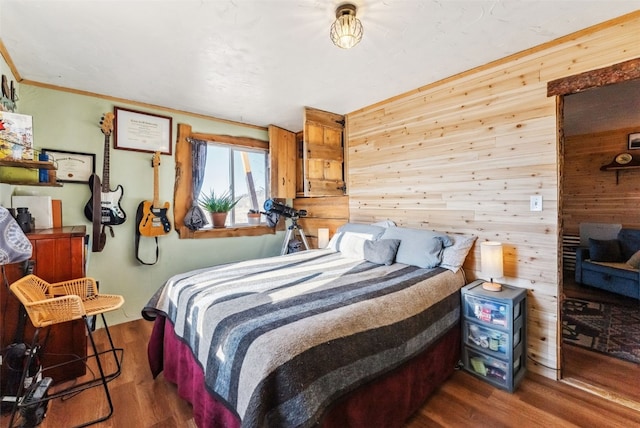 50 Puma Ct, Como, CO 80432 - bedroom featuring ornamental molding, wood finished floors, and wooden walls