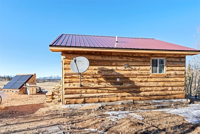 50 Puma Ct, Como, CO 80432 - view of side of property with log veneer siding and metal roof