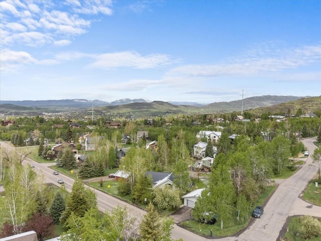 1750 Fish Creek Falls Rd, Steamboat Springs, CO 80487 - aerial overview of property's location featuring a mountainous background and nearby suburban area