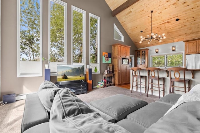 1750 Fish Creek Falls Rd, Steamboat Springs, CO 80487 - living room featuring a chandelier, wood ceiling with exposed beams, light colored carpet, and high vaulted ceiling