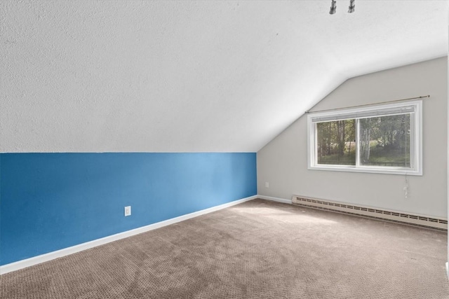 1750 Fish Creek Falls Rd, Steamboat Springs, CO 80487 - bonus room with baseboard heating, vaulted ceiling, baseboards, and carpet flooring