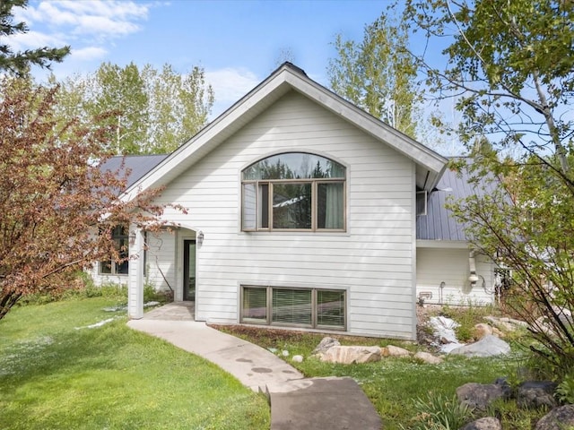 1750 Fish Creek Falls Rd, Steamboat Springs, CO 80487 - view of front of home with a front yard and metal roof