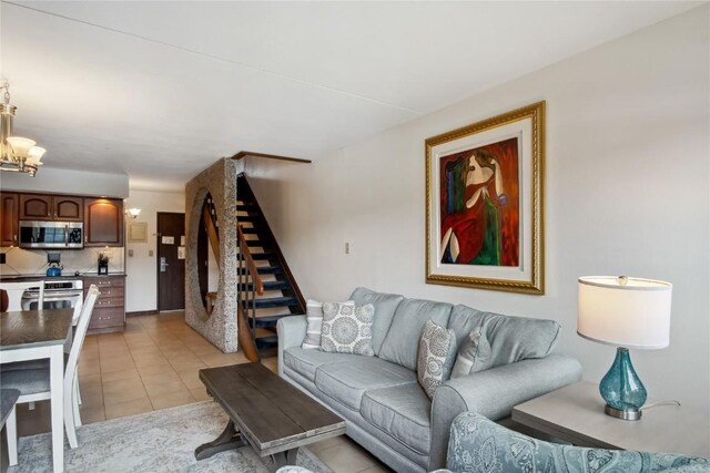 631 Village Rd Unit 36450, Breckenridge, CO 80424 - living room with stairway, an inviting chandelier, and light tile patterned floors