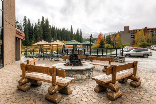 631 Village Rd Unit 36450, Breckenridge, CO 80424 - view of patio / terrace featuring an outdoor fire pit