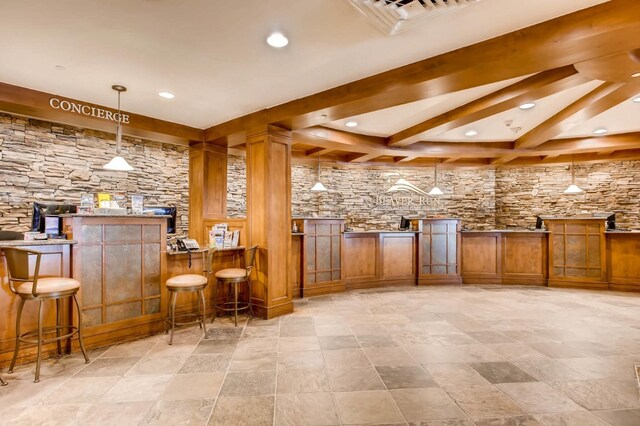 631 Village Rd Unit 36450, Breckenridge, CO 80424 - bar featuring hanging light fixtures, a dry bar, beam ceiling, visible vents, and recessed lighting