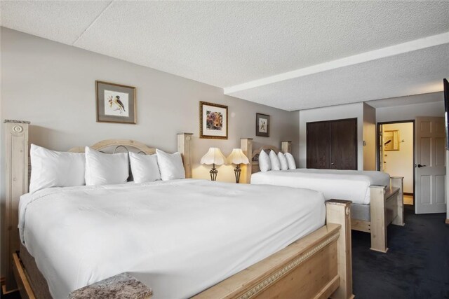 631 Village Rd Unit 36450, Breckenridge, CO 80424 - bedroom featuring dark carpet
