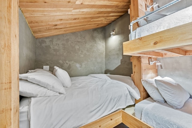 bedroom with wooden ceiling and lofted ceiling