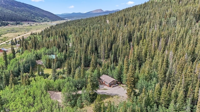 bird's eye view with a view of trees and a mountain view