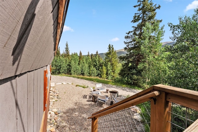 view of yard with a view of trees