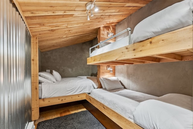 bedroom with lofted ceiling, wood finished floors, and wooden ceiling