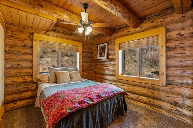 24110 Arapahoe Rd, Oak Creek, CO 80467 - carpeted bedroom featuring multiple windows, beam ceiling, and wood ceiling