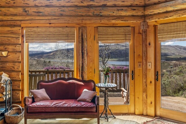 24110 Arapahoe Rd, Oak Creek, CO 80467 - interior space featuring wood-type flooring, rustic walls, and a mountain view