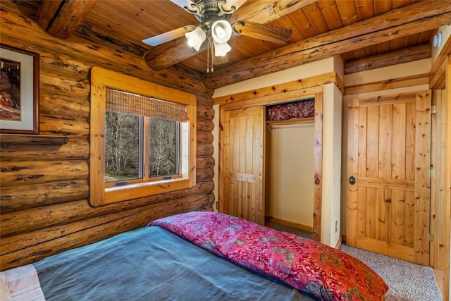 24110 Arapahoe Rd, Oak Creek, CO 80467 - bedroom featuring wooden ceiling, beam ceiling, log walls, and carpet floors