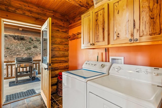 24110 Arapahoe Rd, Oak Creek, CO 80467 - laundry area with washing machine and clothes dryer, log walls, cabinet space, and wood ceiling
