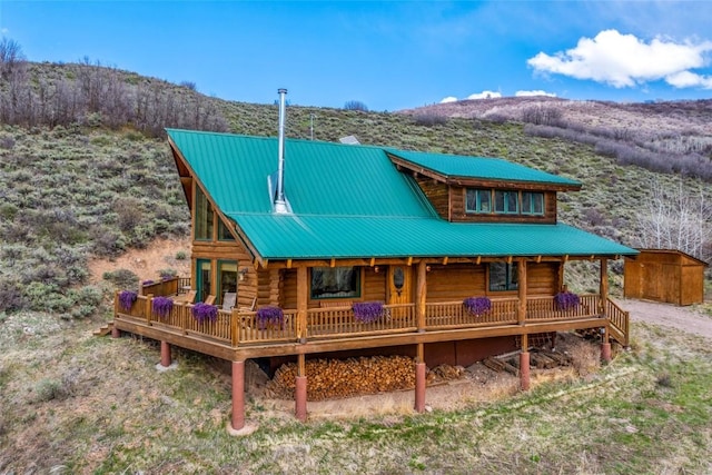 24110 Arapahoe Rd, Oak Creek, CO 80467 - back of house with a mountain view, log siding, and metal roof