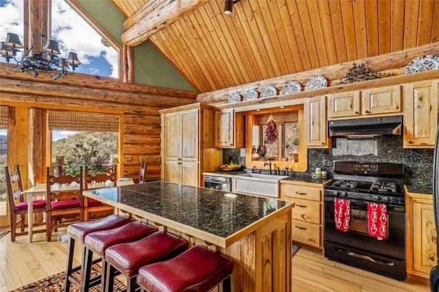 24110 Arapahoe Rd, Oak Creek, CO 80467 - kitchen featuring black gas range oven, wood ceiling, a sink, under cabinet range hood, and tile countertops