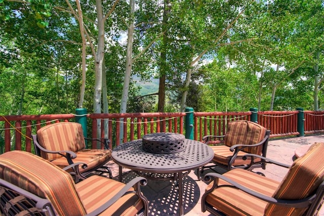 wooden deck featuring outdoor dining space