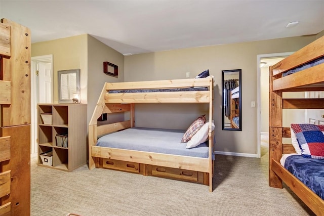 carpeted bedroom featuring baseboards