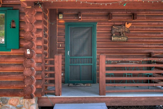 property entrance with log exterior