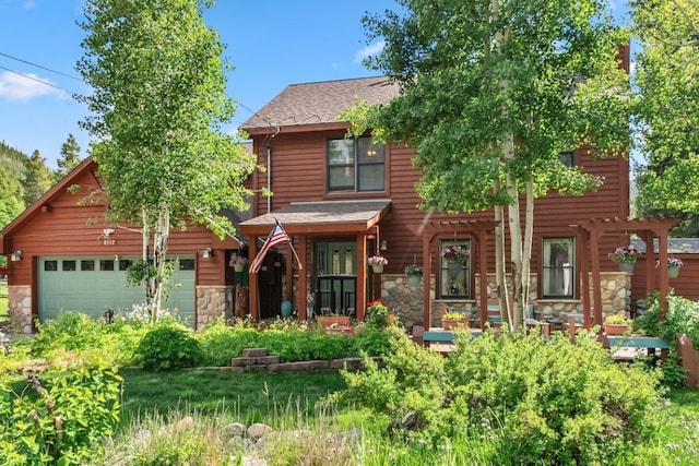 112 Grey Squirrel Ln, Breckenridge, CO 80424 - view of front of property featuring stone siding, a shingled roof, and a garage