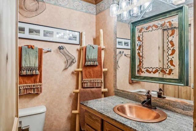 112 Grey Squirrel Ln, Breckenridge, CO 80424 - half bathroom with toilet, vanity, and a chandelier