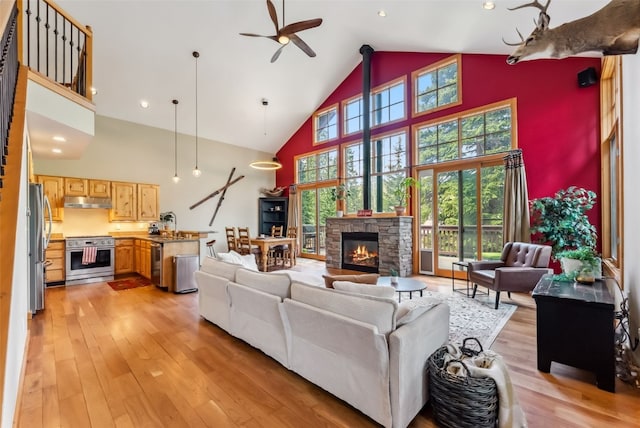 960 Whispering Pines Ln, Breckenridge, CO 80424 - living area featuring high vaulted ceiling, ceiling fan, light wood-style floors, a fireplace, and recessed lighting