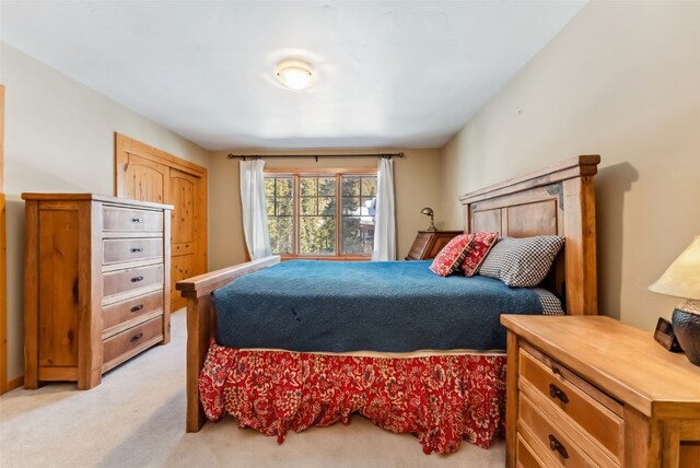 960 Whispering Pines Ln, Breckenridge, CO 80424 - bedroom with light wood-style flooring, a chandelier, recessed lighting, and high vaulted ceiling