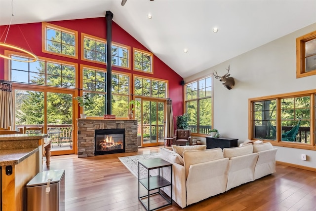 960 Whispering Pines Ln, Breckenridge, CO 80424 - living room with high vaulted ceiling, wood-type flooring, a fireplace, recessed lighting, and ceiling fan
