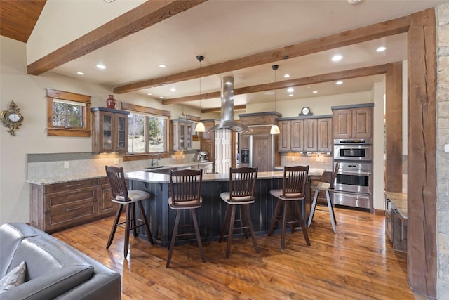 210 Game Trail Rd, Silverthorne, CO 80498 - kitchen featuring recessed lighting, glass insert cabinets, light wood finished floors, a sink, and a warming drawer