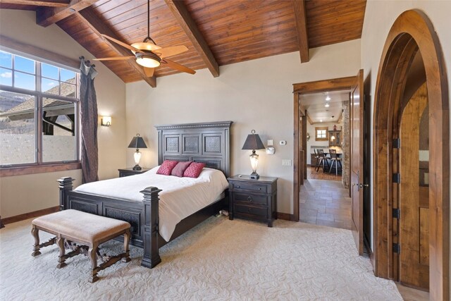 210 Game Trail Rd, Silverthorne, CO 80498 - bedroom with vaulted ceiling with beams, baseboards, ceiling fan, arched walkways, and wooden ceiling