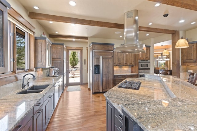 210 Game Trail Rd, Silverthorne, CO 80498 - kitchen with a sink, island exhaust hood, paneled built in fridge, gas stovetop, and light wood-type flooring