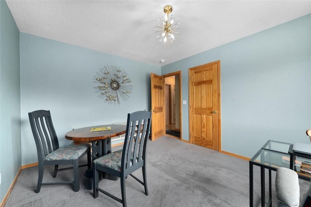 27426 Brandon Cir, Steamboat Springs, CO 80487 - dining space with light carpet and a chandelier