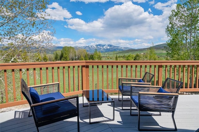 27426 Brandon Cir, Steamboat Springs, CO 80487 - deck with a mountain view, an outdoor living space, and a lawn