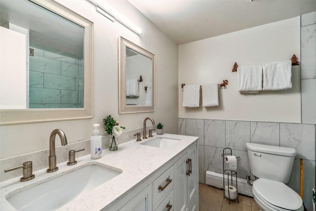 370 E Ln Bonte St Unit A, Dillon, CO 80435 - full bath with double vanity, tile walls, toilet, and a sink