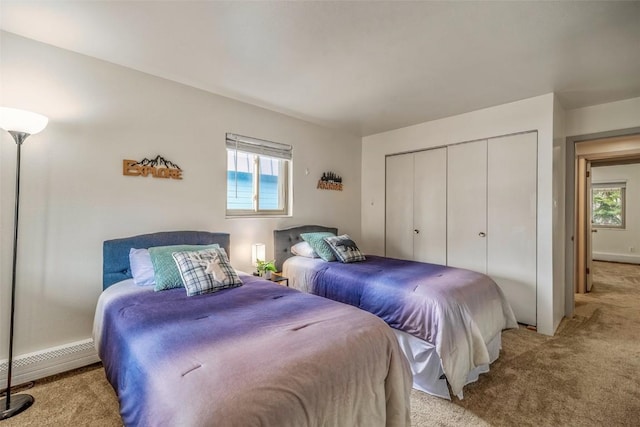 370 E Ln Bonte St Unit A, Dillon, CO 80435 - bedroom with light carpet, multiple windows, and a closet