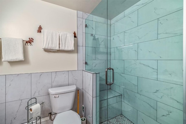 370 E Ln Bonte St Unit A, Dillon, CO 80435 - full bathroom with tile walls, a shower stall, and toilet