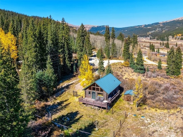 28 No Name Ln, Alma, CO 80420 - aerial view of property and surrounding area featuring a heavily wooded area and a mountain backdrop
