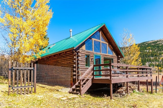 28 No Name Ln, Alma, CO 80420 - view of property exterior with a deck, log exterior, and metal roof