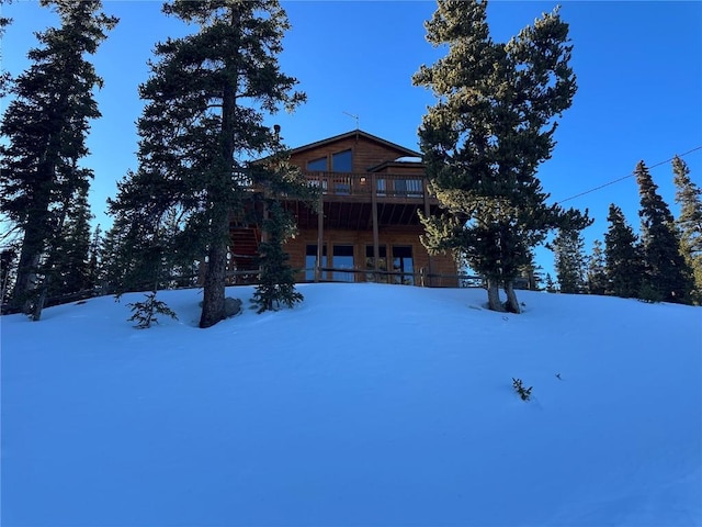 view of snow covered house