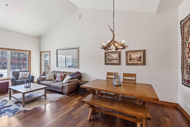 101 E Main St Unit 301, Frisco, CO 80443 - living area featuring a chandelier, wood-type flooring, high vaulted ceiling, and baseboards